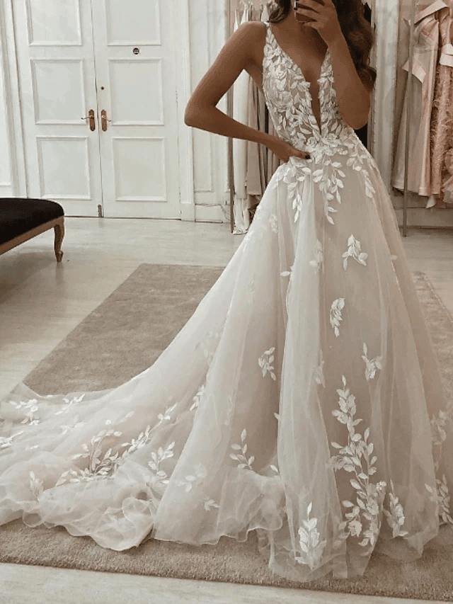 Sleeveless A-line wedding dress with a unique plunging neckline