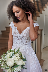 A-line off shoulder V-neck sheer and floor length wedding dress