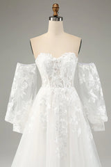 White A-line chiffon long sleeved wedding dress with applique lace