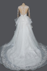 Elegant Long Sleeve Ball Gown Wedding Dress with Lace Appliques