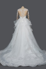 Elegant Long Sleeve Ball Gown Wedding Dress with Lace Appliques