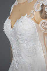 Elegant Long Sleeve Ball Gown Wedding Dress with Lace Appliques