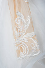 Elegant Long Sleeve Ball Gown Wedding Dress with Lace Appliques