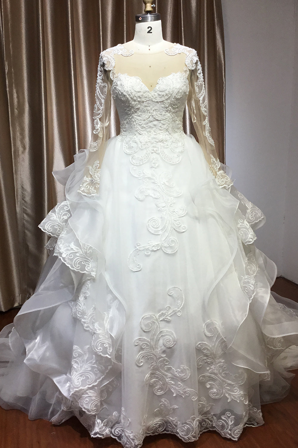 Elegant Long Sleeve Ball Gown Wedding Dress with Lace Appliques
