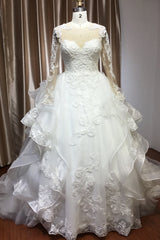 Elegant Long Sleeve Ball Gown Wedding Dress with Lace Appliques