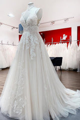 Stunning Tulle A-line V-neck Wedding Dress with Ruffles and Lace Appliques