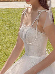 A-Line Wedding Dresses Spaghetti Strap Sweep / Brush Train Lace Tulle Sleeveless Country Romantic Vintage Backless with Bow(s) - RongMoon